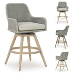 2 Ashley Signature Design Outdoor Swivel Bar Stools with Cushions